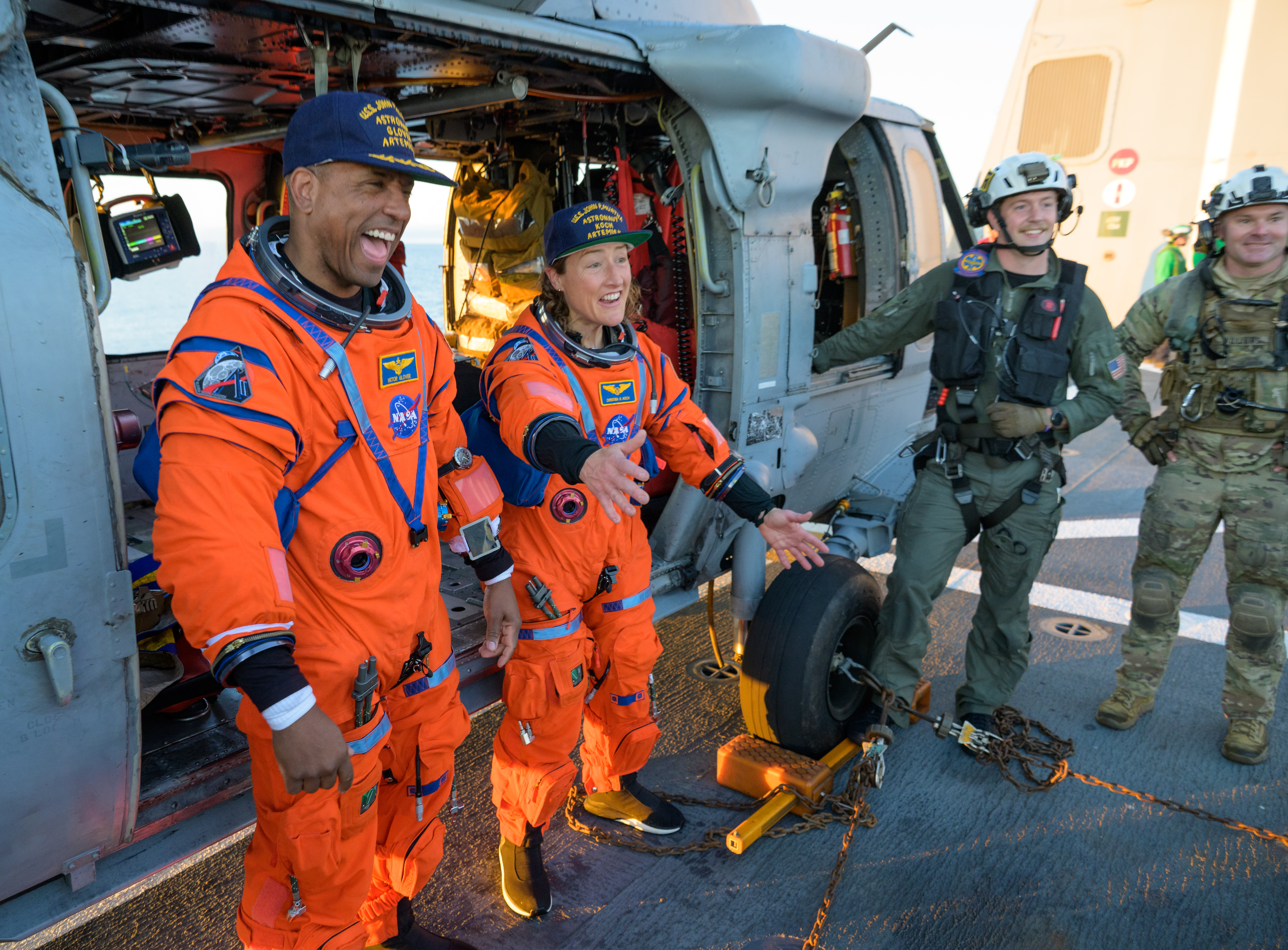 NASA astronaut Victor Glover, Artemis II pilot, left, and NASA astronaut Christina Koch, Artemis II mission specialist are seen sitting...