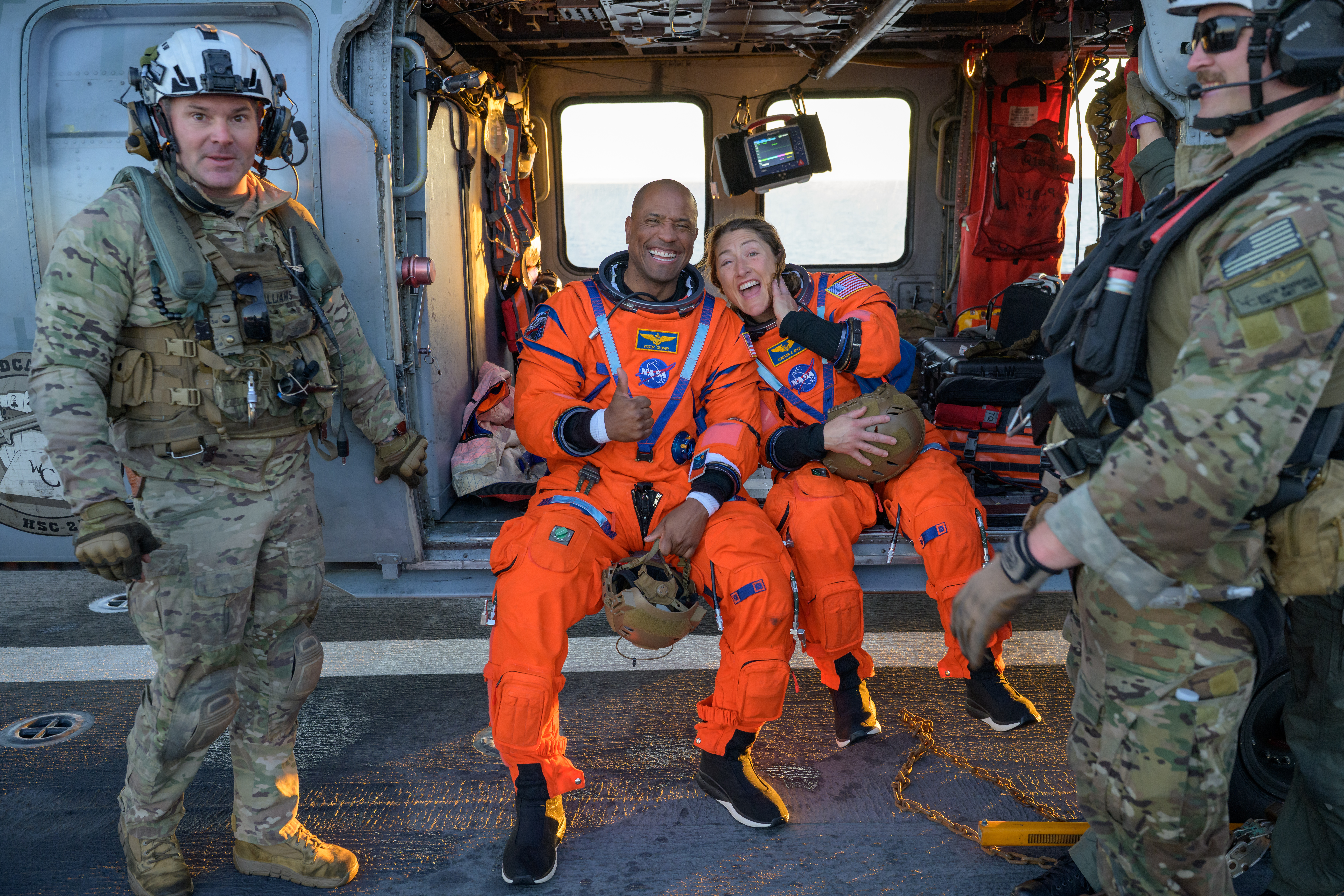 NASA astronaut Victor Glover, Artemis II pilot, left, and NASA astronaut Christina Koch, Artemis II mission specialist are seen sitting...
