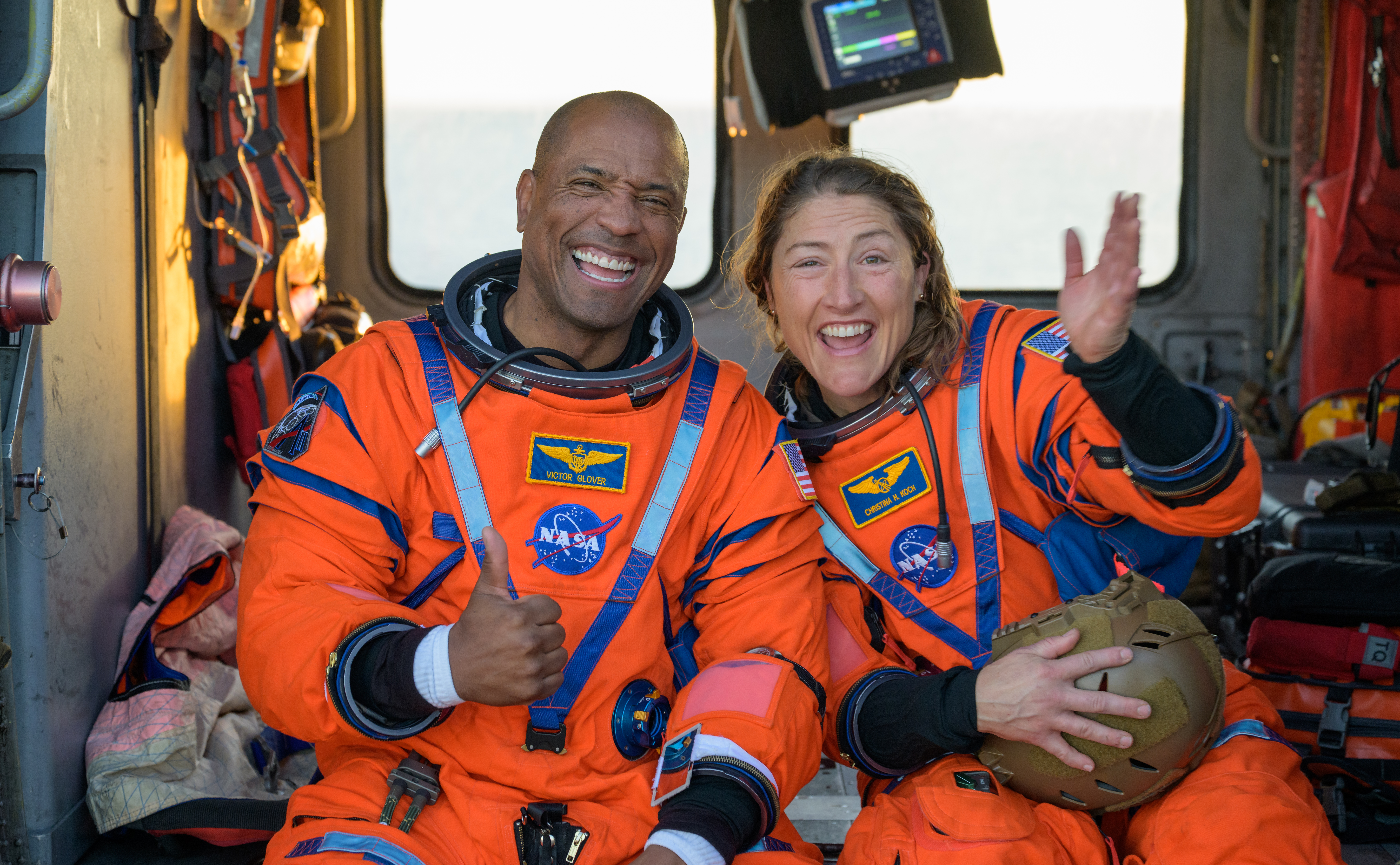 NASA astronaut Victor Glover, Artemis II pilot, left, and NASA astronaut Christina Koch, Artemis II mission specialist are seen sitting...