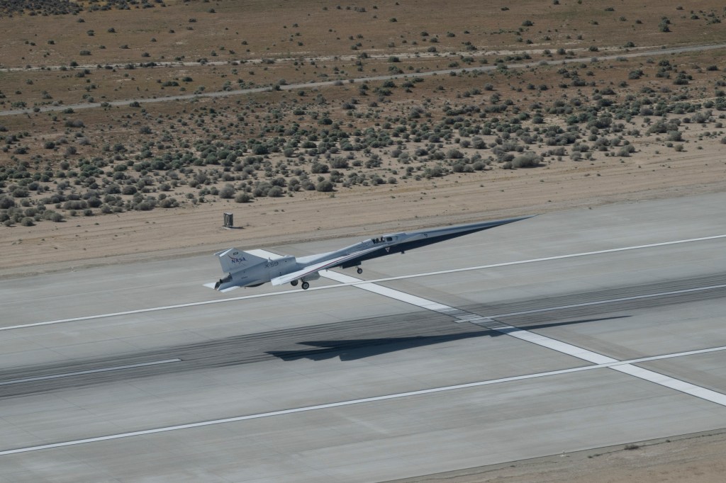 NASA's X-59 taking off from the runway at Edwards Air Force Base.
