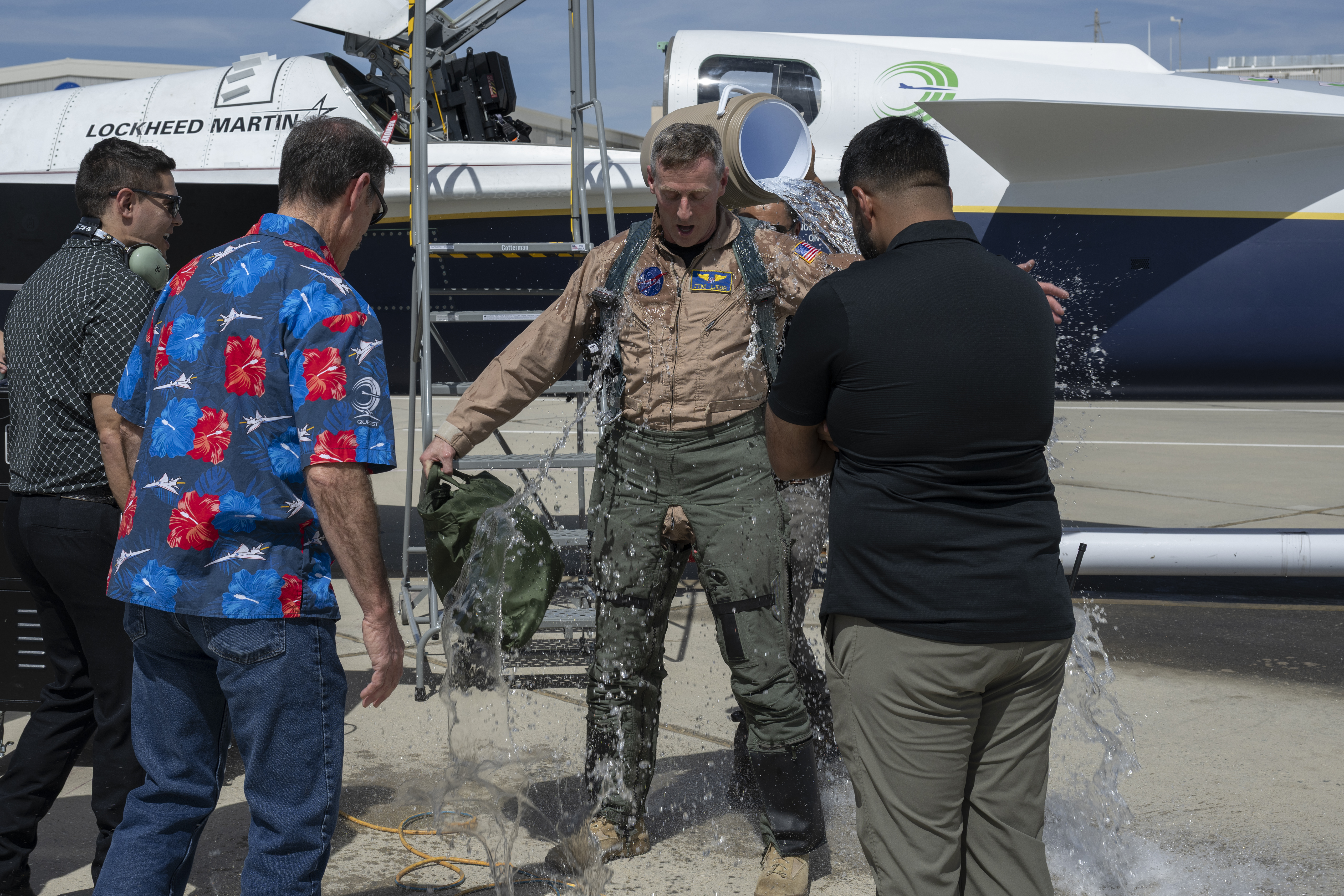 NASA's X-59 Test Pilot being drenched with water after completing his first flight.