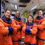 Artemis II NASA astronauts (left to right) Reid Wiseman, Victor Glover, and Christina Koch, and CSA (Canadian Space Agency) astronaut Jeremy Hansen stand in the white room on the crew access arm of the mobile launcher at Launch Pad 39B as part of an integrated ground systems test at Kennedy Space Center in Florida on Wednesday, Sept. 20, 2023. The test ensures the ground systems team is ready to support the crew timeline on launch day.