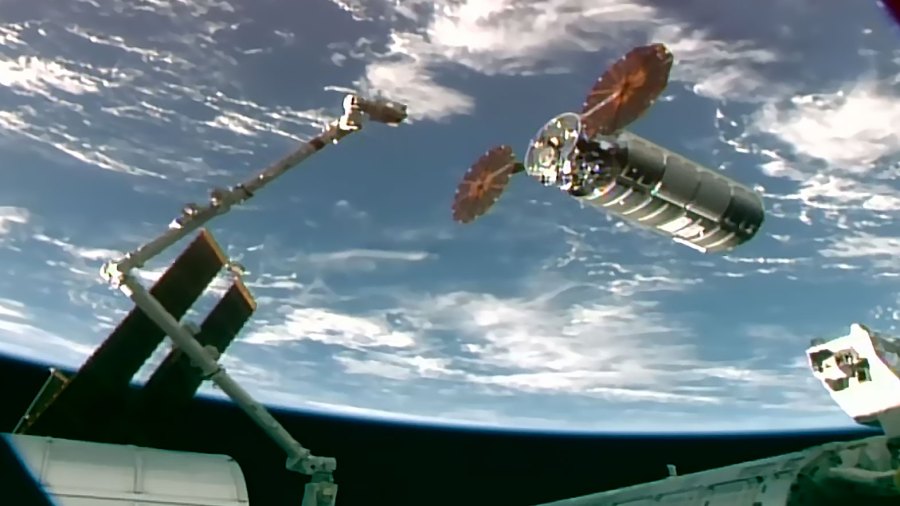 The Cygnus XL cargo spacecraft arrives at its capture point 12 meters away from the International Space Station before the Canadarm2 robotic arm, operated by NASA astronaut Chris Williams, reaches out and grapples the resupply ship.