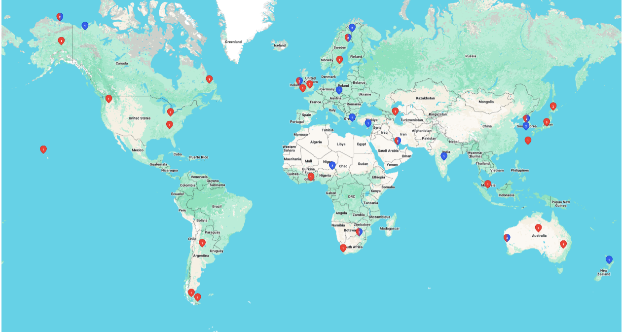 world map with blue and red pins on it