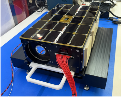 a rectangular box-shaped object with solar arrays on one side
