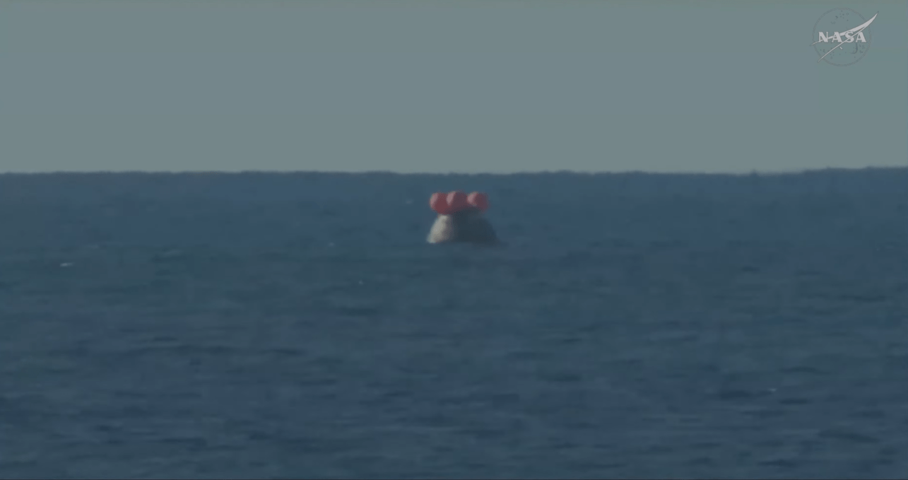 The Orion spacecraft with the Artemis II crew inside is seen floating in the Pacific Ocean after splashing down at 8:07 p.m. EDT on April 10, 2026.