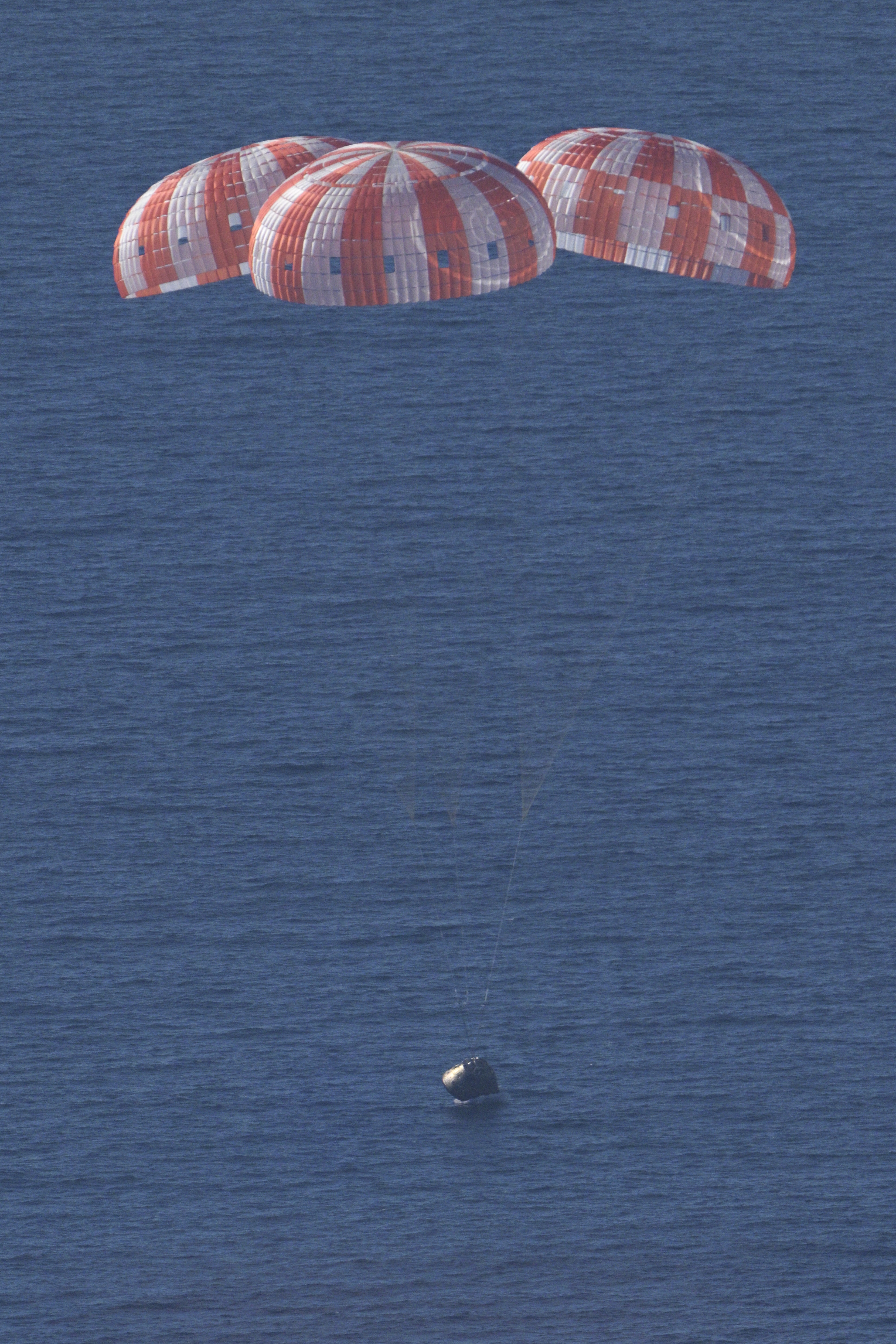 NASA's Orion spacecraft carrying Artemis II Commander Reid Wiseman, Pilot Victor Glover, and Mission Specialist Christina Koch from NASA, along...