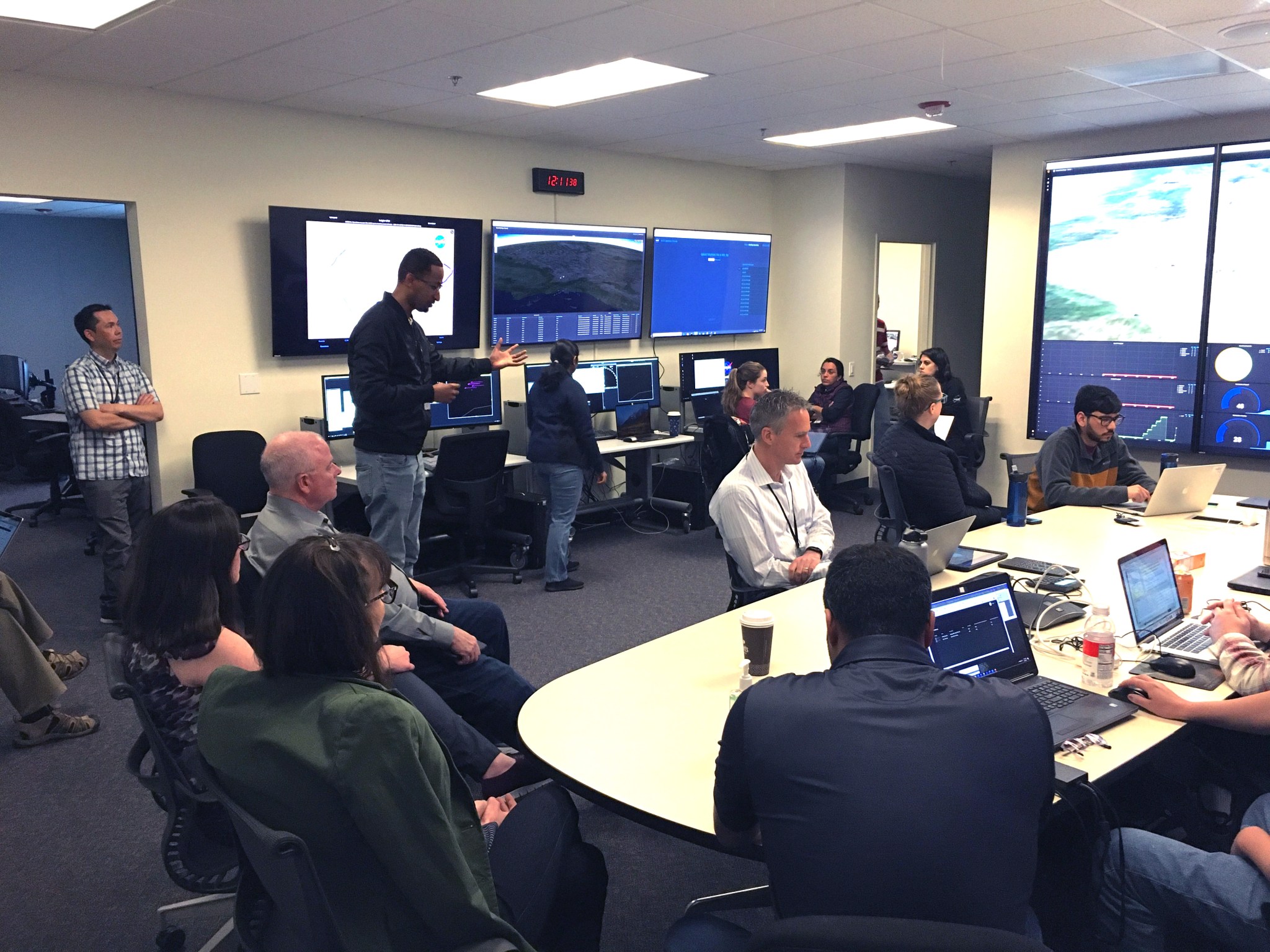 Researchers and Engineers in NASA Ames Research Center's Airspace Operations Laboratory (AOL) preparing for an Advanced Air Mobility (AAM) simulation.