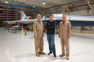 NASA Administrator Jared Isaacman, center, and NASA pilots Nils Larson, left, and Jim Less, right, pose for a photograph with the X-59 aircraft.