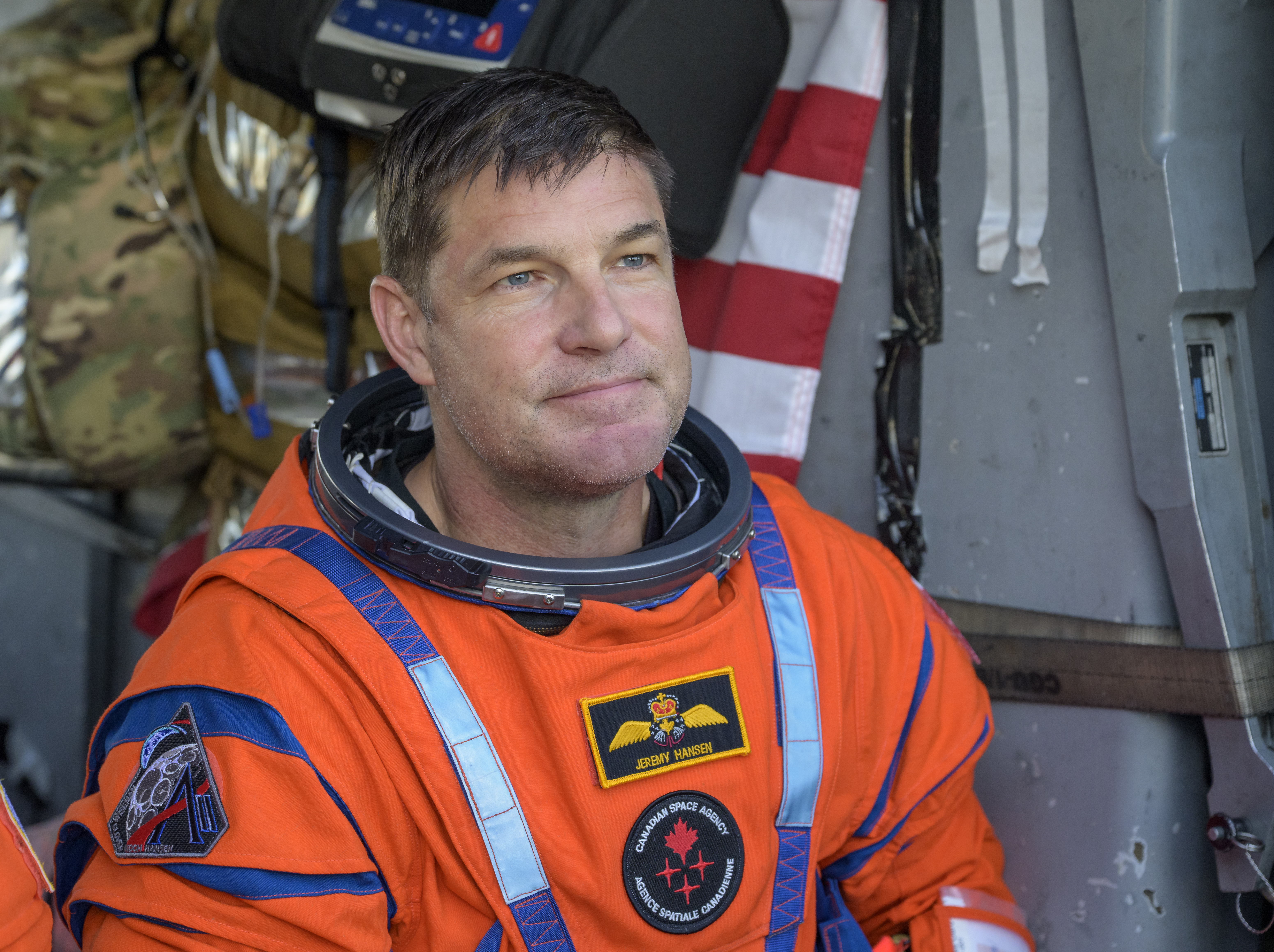 CSA (Canadian Space Agency) astronaut Jeremy Hansen, Artemis II mission specialist is seen sitting in a Navy MH-60 Seahawk from...