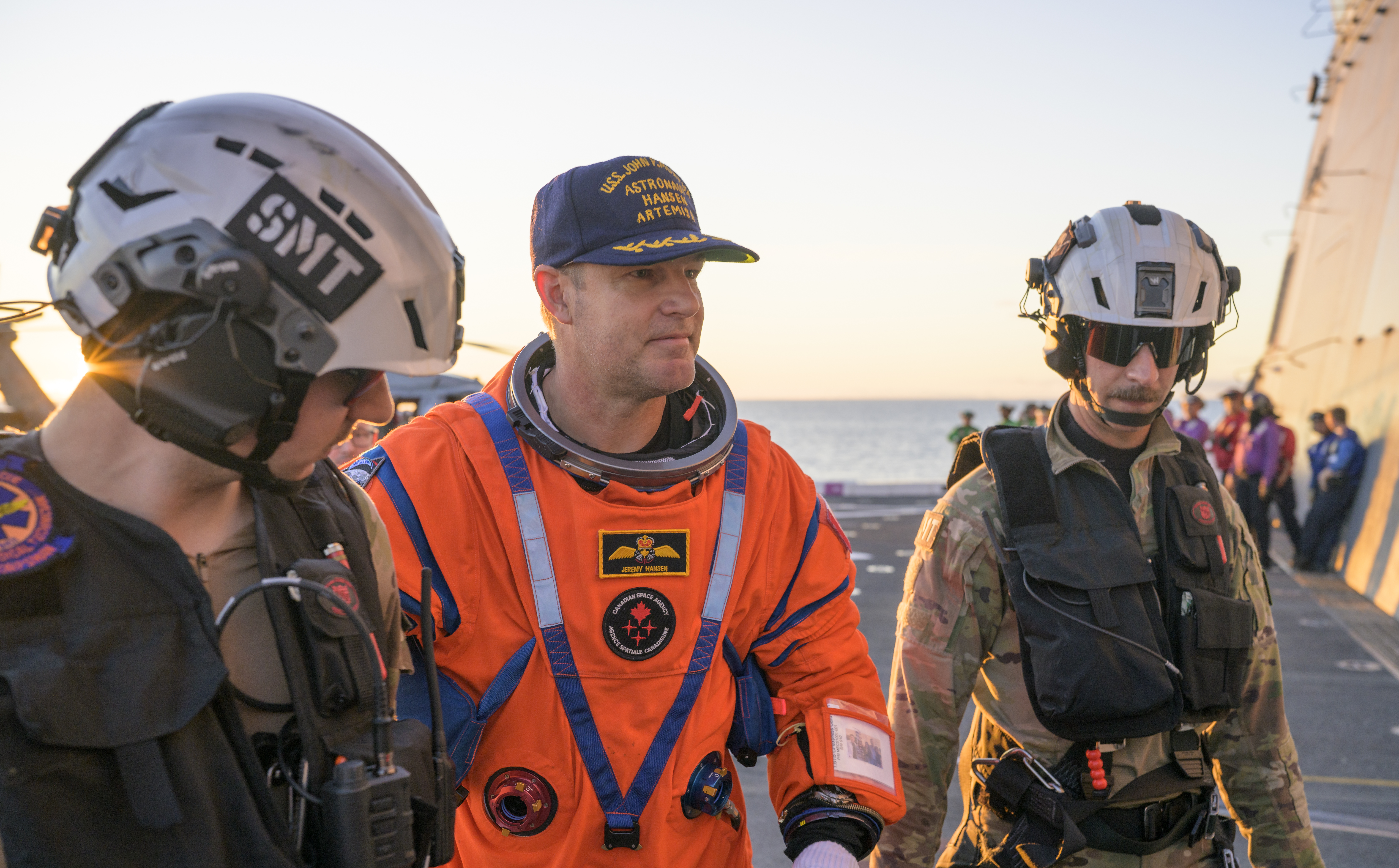 CSA (Canadian Space Agency) astronaut Jeremy Hansen, Artemis II mission specialist is assisted off the flight deck after arriving aboard...