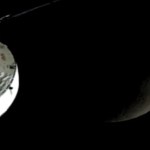 A live view from the Orion spacecraft shows Orion, the Moon, and the Earth.