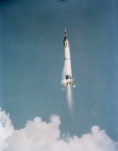 In this view from below, the Mercury-Redstone 3 space vehicle shines in the morning sun as it soars into the blue sky above Cape Canaveral, Florida.