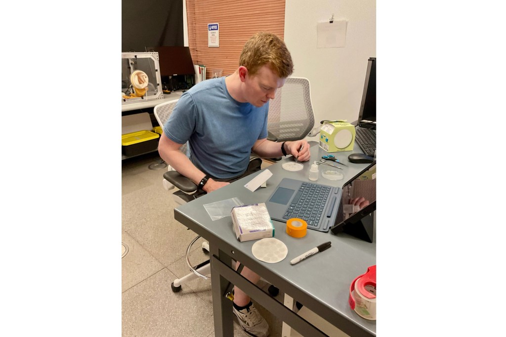 Crew Health and Performance Exploration Analog (CHAPEA) Mission 2 flight engineer, James Spicer, working on a science task involving seed germination.