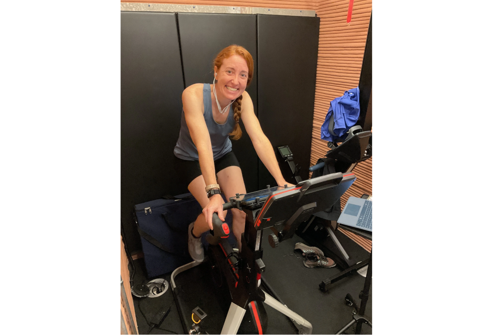 Crew Health and Performance Exploration Analog (CHAPEA) Mission 2 medical officer, Ellen Ellis, exercising in the habitat using a stationary bike.