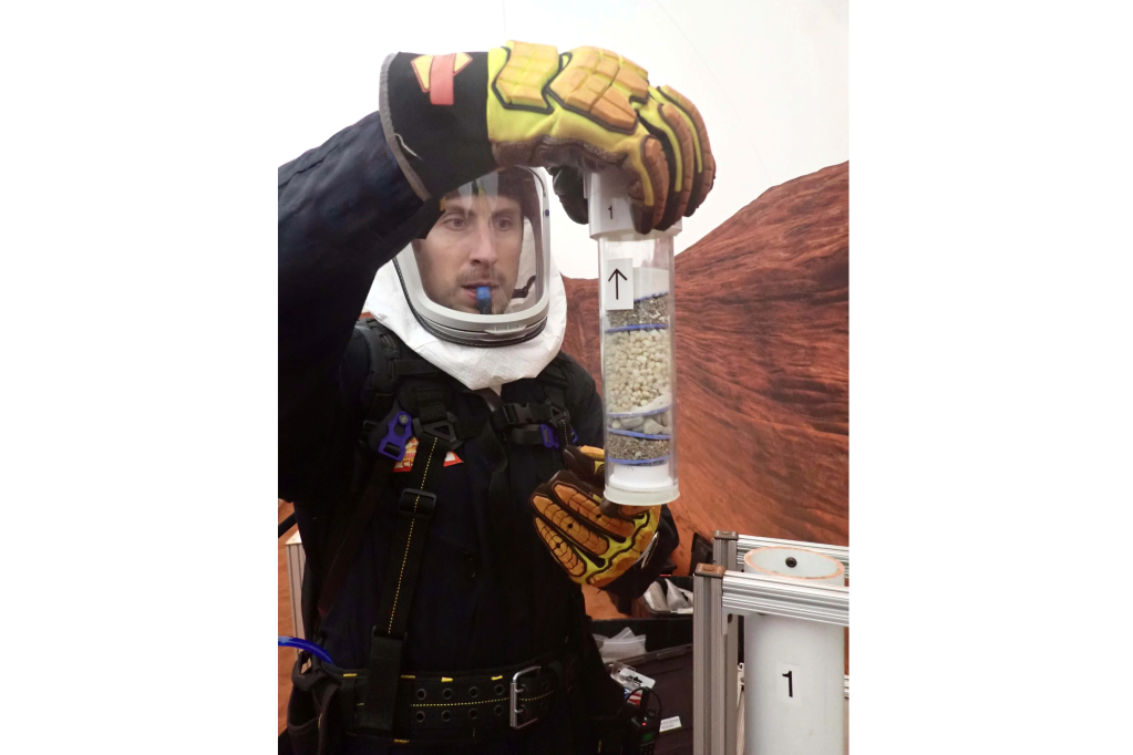 Ross Elder, Crew Health and Performance Exploration Analog (CHAPEA) Mission 2 commander, participates in an extravehicular geological activity.