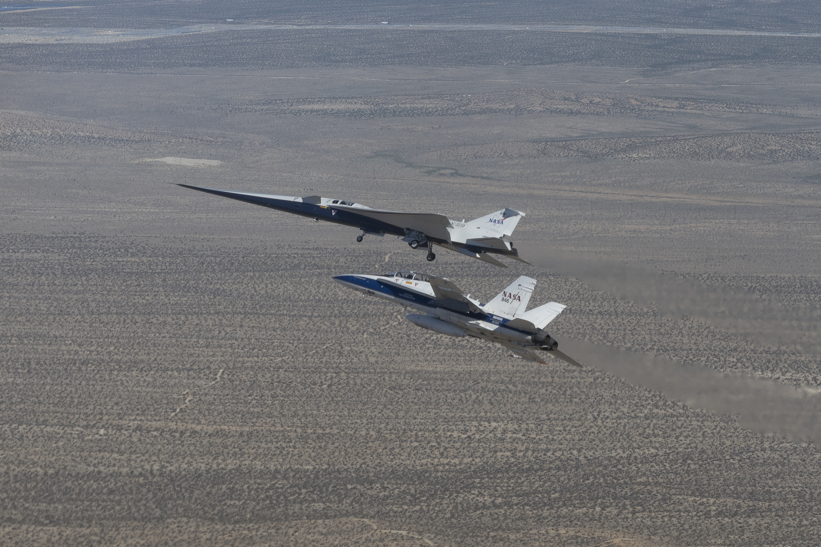 X-59 in flight with the F/A-18 aircraft.