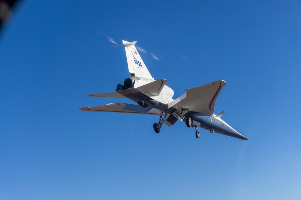 Bottom view of the X-59 aircraft while it's in flight.