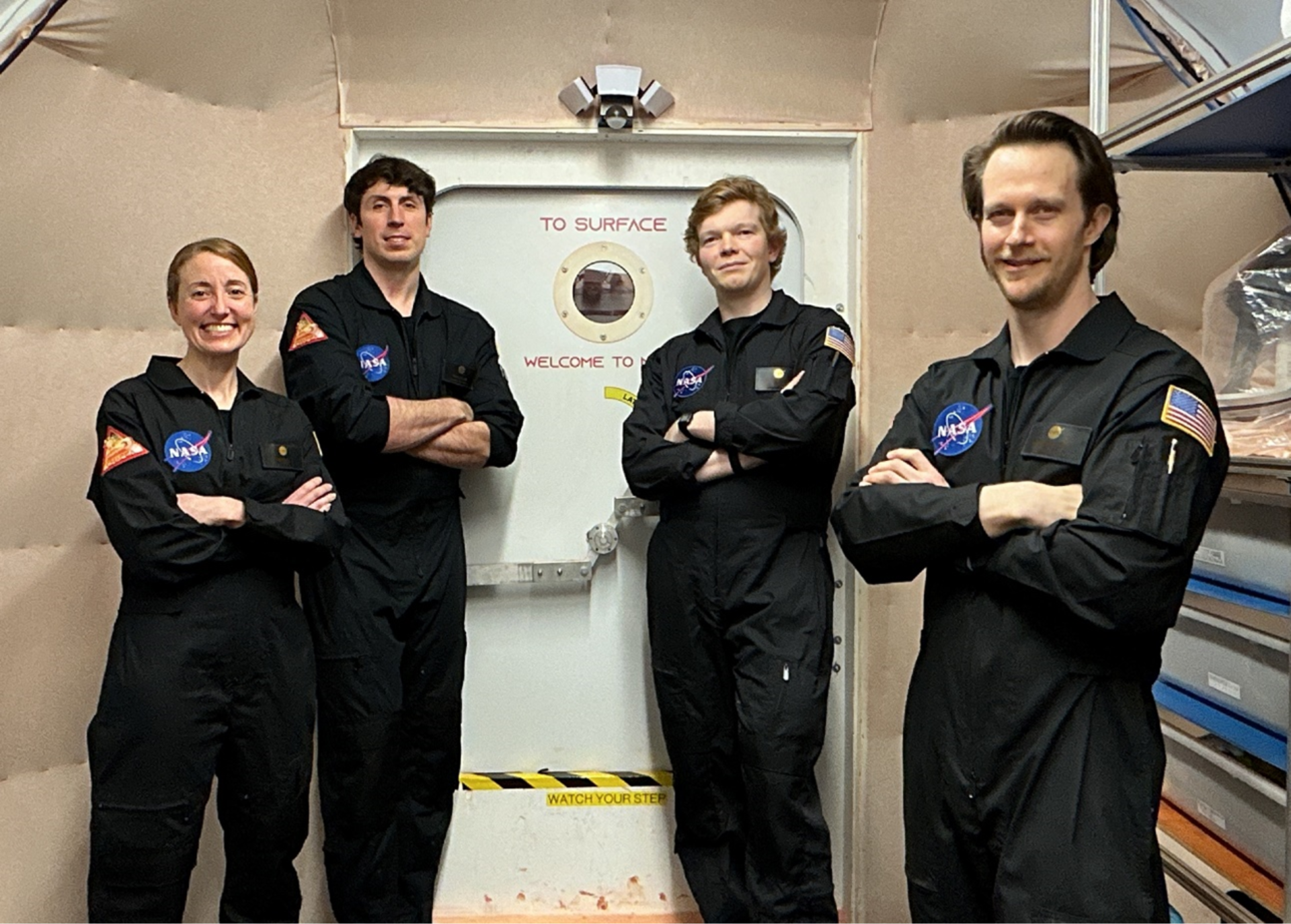 Members of NASA’s CHAPEA (Crew Health and Performance Exploration Analog) mission 2 pose for a group photo. (From left to right: Ellen Ellis, Ross Elder, James Spicer, Matthew Montgomery)
