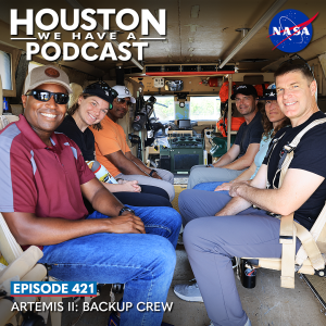 Houston We Have a Podcast Episode 421: Artemis II: Backup Crew The Artemis II Crew, including backup crew members NASA astronaut Andre Douglas and Canadian Space Agency astronaut Jenni Gibbons, sit in the back of a transport van.