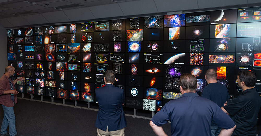Photo of the fourth-generation hyperwall cluster installed at the NAS facility. The 128-screen hyperwall visualization system can display unique images in selected "cells", as seen here, or can display a single image across all screens.