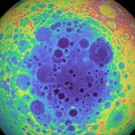 Color-enhanced topographic image of the Moon highlighting the South Pole-Aitken Basin, one of the largest impact basins in the solar system, with varying colors representing differences in elevation across the cratered lunar surface.