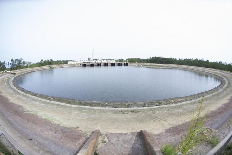The reservoir at Stennis Space Center on May 11 shown at a dramatically lowered level, exposing large areas of the reservoir floor after 40 million gallons were pumped out.