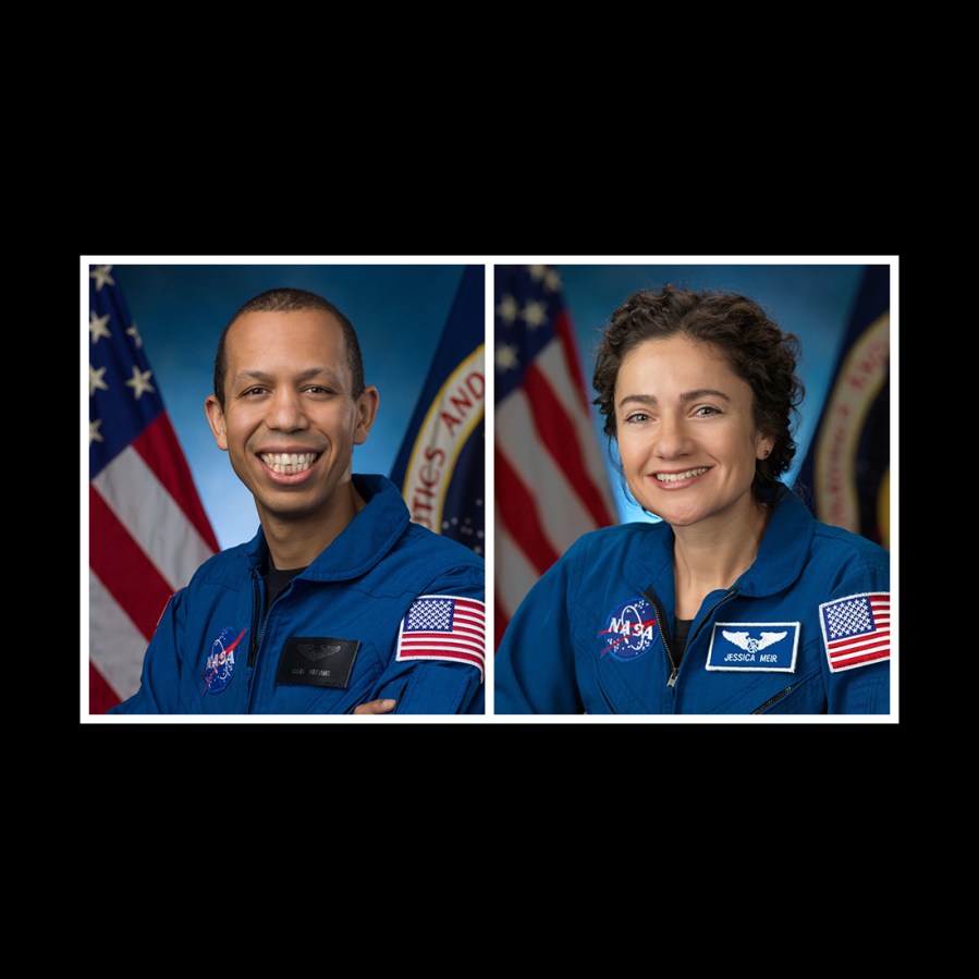 NASA astronauts Chris Williams and Jessica Meir pose for their official portraits at NASA's Johnson Space Center in Houston, Texas.