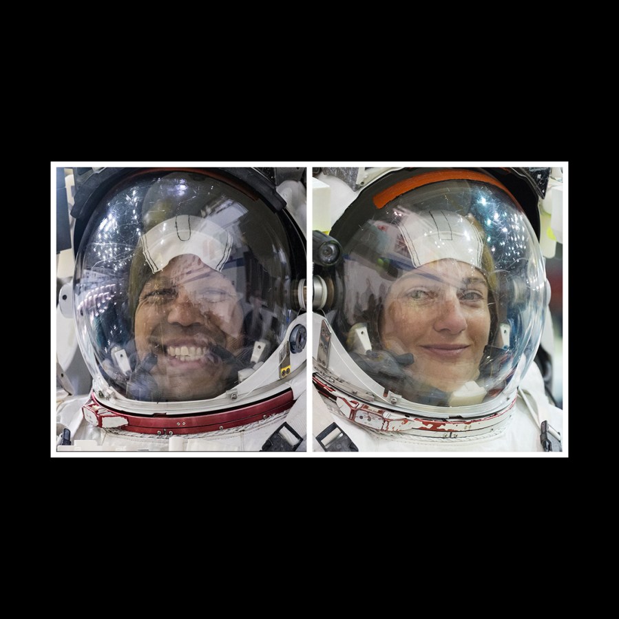 NASA astronauts Chris Williams and Jessica Meir are pictured training for a spacewalk in their spacesuits at NASA's Neutral Buoyancy Laboratory in Houston, Texas.