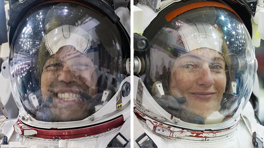 NASA astronauts Chris Williams and Jessica Meir are pictured training for a spacewalk in their spacesuits at NASA's Neutral Buoyancy Laboratory in Houston, Texas.