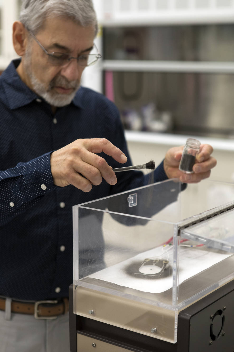 Dr Calle prepres an Electrostatic Dust Shield for testing