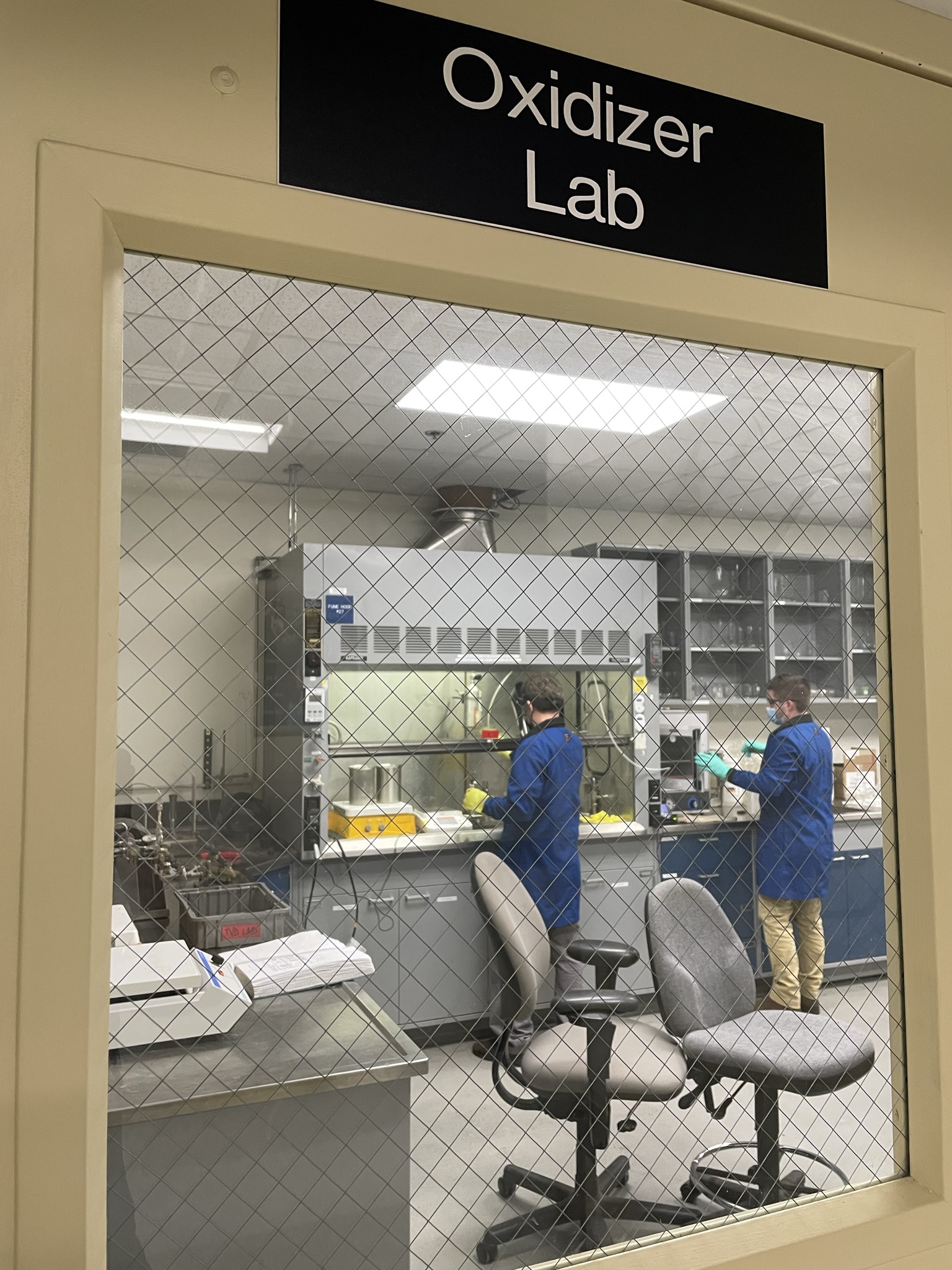 Chemical Sampling & Analysis Lab employees working in Oxidizer Lab