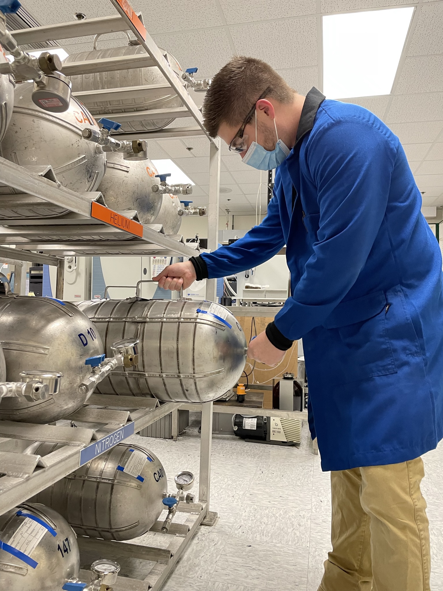 Chemical Sampling and Analysis Lab employee handling nitrogen tank