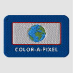 A rectangular patch made of embroidered thread: the border is dark blue with the words COLOR-A-PIXEL in white. A smaller white rectangle sits above the words, outlined in a thin line of red with a blue and green globe inside.