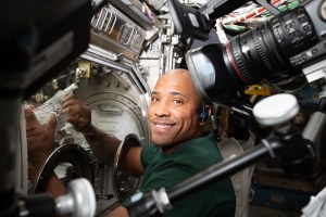Astronaut Victor Glover performs a sample exchange in the Microgravity Science Glovebox (MSG) as part of the Fiber Optic Production.