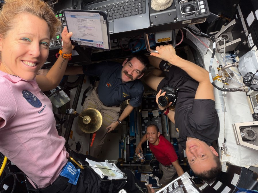 Expedition 74 crew members (from left) Sophie Adenot of ESA (European Space Agency), NASA astronauts Jack Hathaway and Chris Williams, and Roscosmos cosmonaut Sergey Kud‑Sverchkov pose for a portrait together inside the International Space Station’s cupola and Tranquility module.