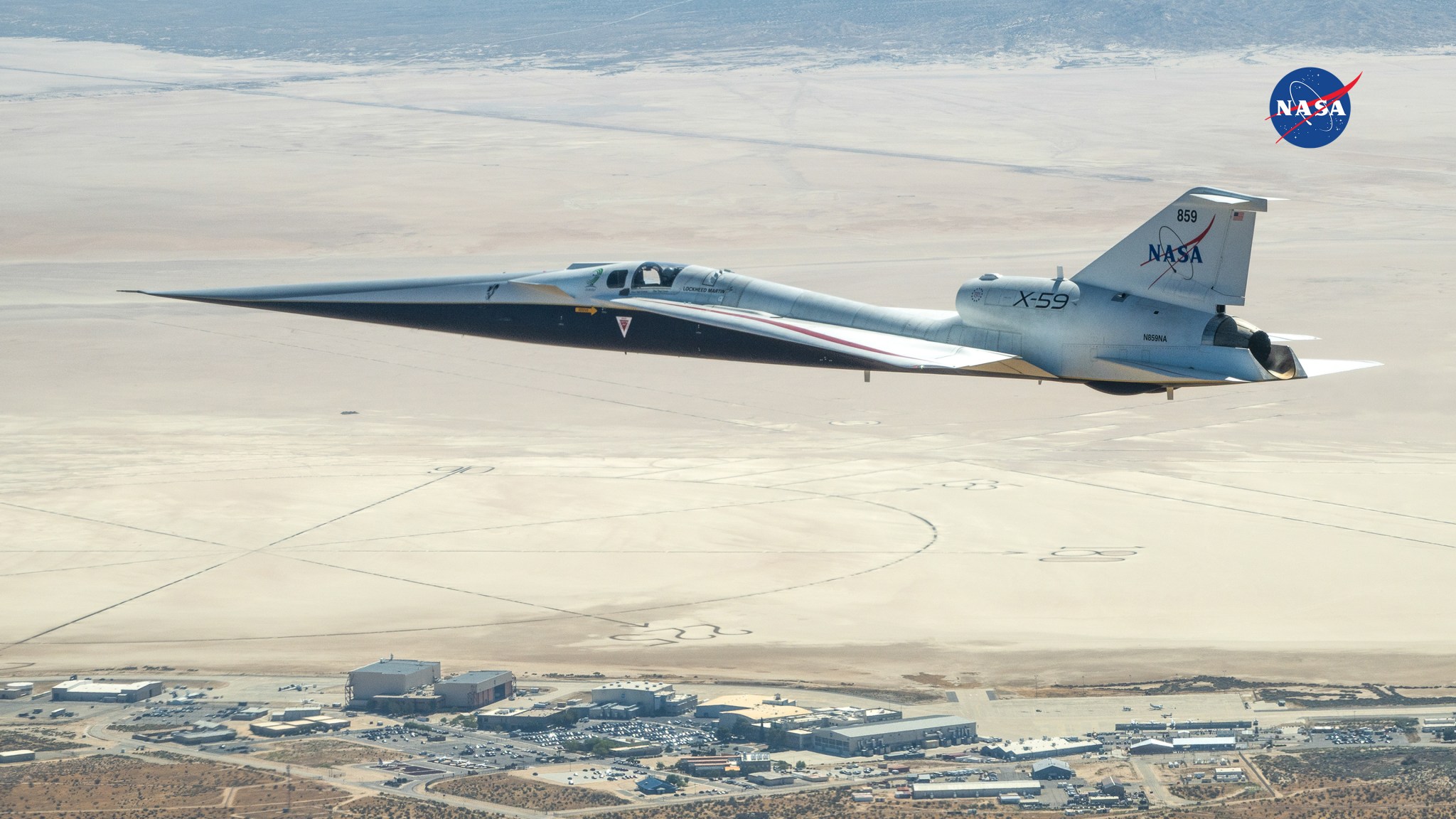 NASA’s X-59 flies over the agency’s Armstrong Flight Research Center in California’s high desert.