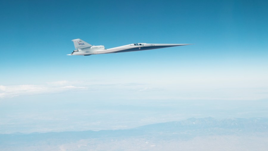 The X-59 in flight on June 12, 2026 against a blue sky.