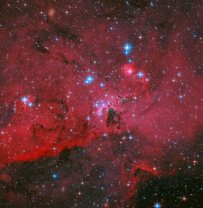 Hubble Sees Crimson Cloud and Stars