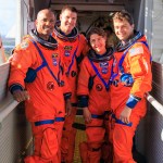 The crew of Artemis II are wearing orange suits seen on the gantry of the launch pad