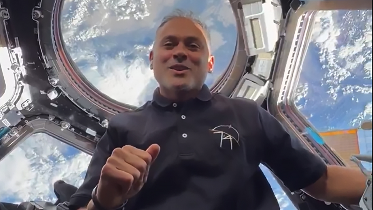 NASA astronaut and Expedition 74 flight engineer Anil Menon is pictured in the cupola with the Earth below while he filmed his first impressions of living aboard the International Space Station.