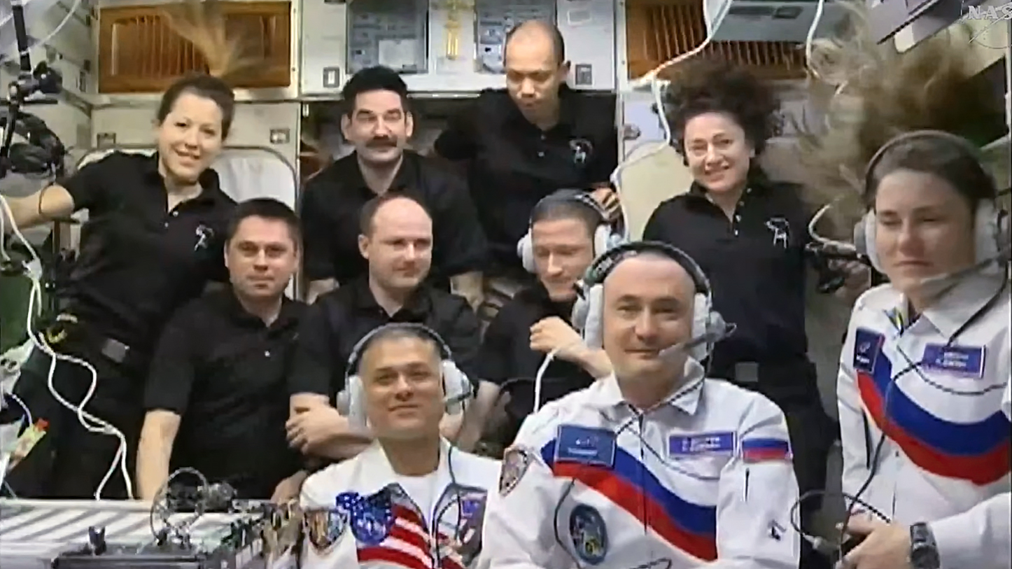 In the front row from left, are new Expedition 75 crew members Anil Menon of NASA and Roscosmos cosmonauts Pyotr Dubrov and Anna Kikina. In the second row, are Roscosmos cosmonauts Andrey Fedyaev, Sergei Mikaev, and Sergey Kud-Sverchkov. In the back, are Sophie Adenot of ESA and NASA astronauts Jack Hathaway, Chris Williams, and Jessica Meir.