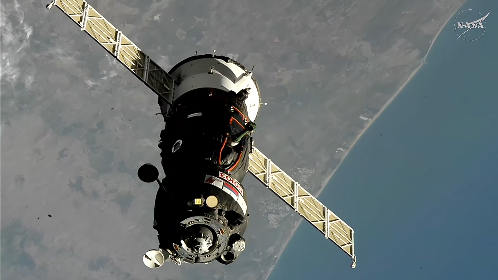 The Soyuz MS-29 spacecraft approaches the International Space Station while orbiting above northern Africa.