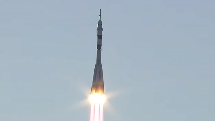 The Soyuz MS-29 spacecraft ascends toward Earth orbit shortly after lifting off from the Baikonur Cosmodrome in Kazakhstan.