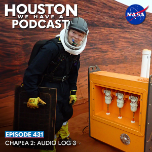 Houston We Have a Podcast Episode 431: CHAPEA 2: Audio Log 3 CHAPEA 2 crew member James Spicer poses next to some equipment on the simulated Mars surface during an EVA.