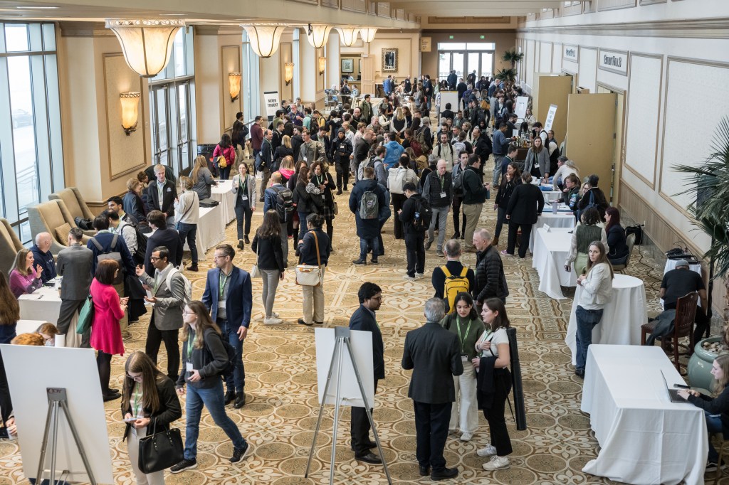 NASA's Human Research Program Investigators' Workshop (IWS) attendees mingle in a hall of the Galveston Island Convention Center between sessions.