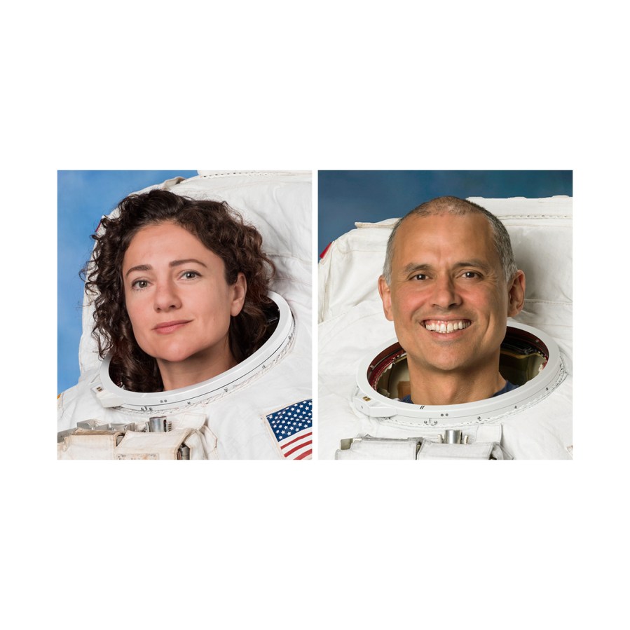 NASA astronauts Jessica Meir and Anil Menon pose for their official portraits while wearing spacesuits at the Johnson Space Center in Houston, Texas.