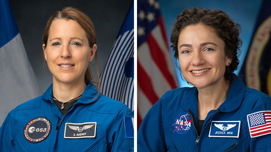 Astronauts Sophie Adenot of ESA and Jessica Meir of NASA pose for their official crew at the Johnson Space Center in Houston, Texas.