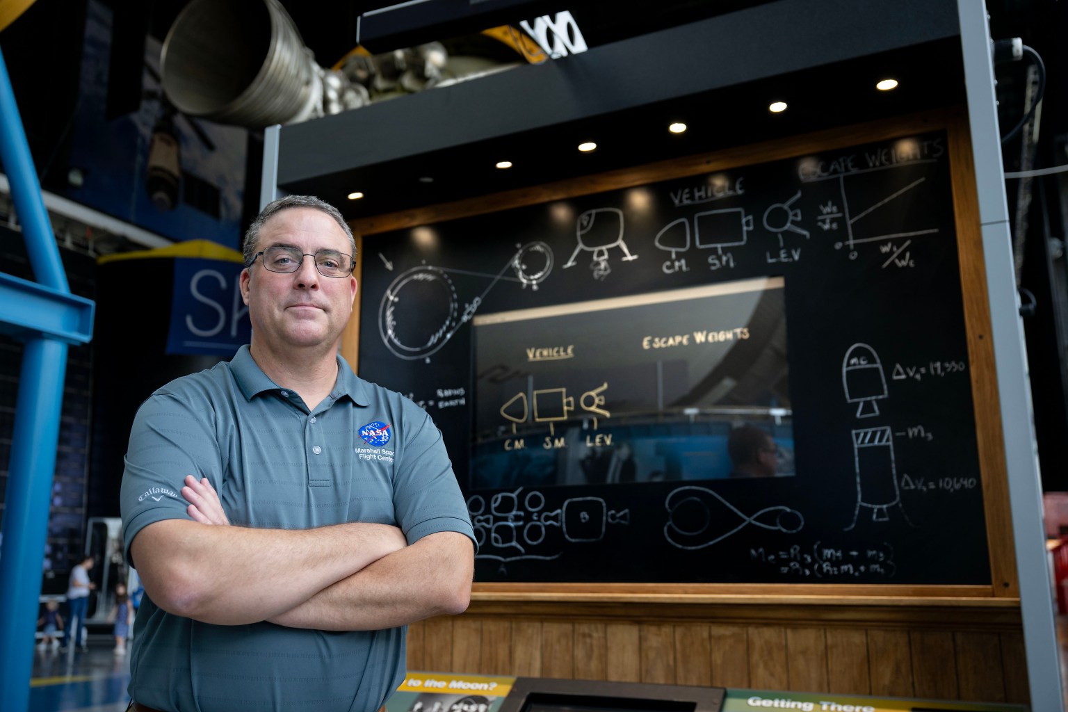 Tom Percy, manager of systems engineering and integration for NASA’s Human Landing Systems Program, stands in front of an Apollo Program lander exhibit at the U.S. Space and Rocket Center in Huntsville near NASA’s Marshall Space Flight Center.