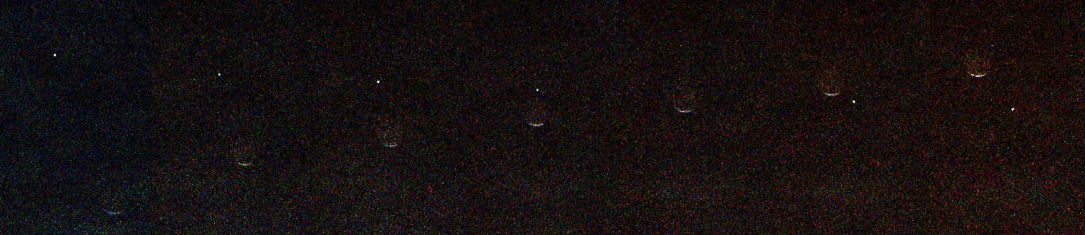 A grainy black image showing a horizontal sequence of seven faint crescent shapes evenly spaced from left to right. A tiny bright white dot moves diagonally from the upper left to the lower right, appearing to pass behind the crescent shapes.